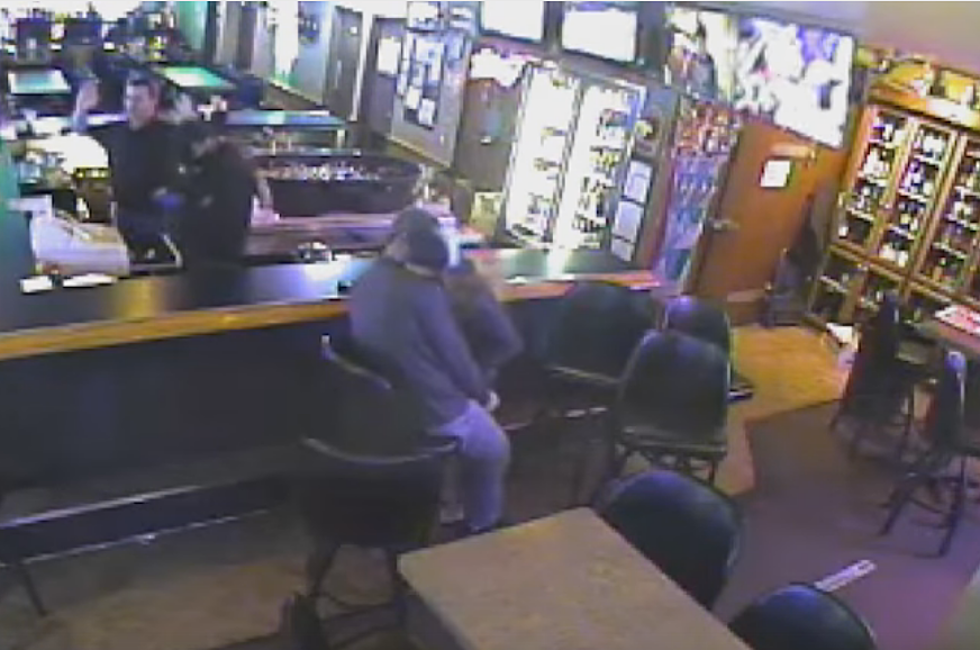 Couple Making Out Completely Oblivious To Robbery At Local Bar [Video]