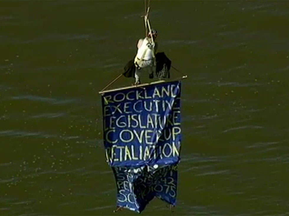 Former New York State Worker Dangles from Bridge With Protest Banner [VIDEO]