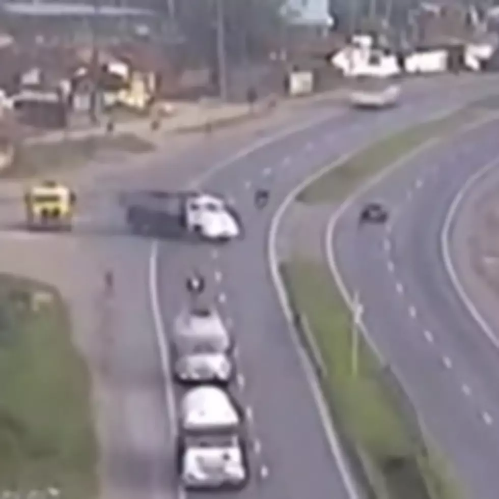 Motorcyclist Slides Under Truck and Survives [VIDEO]