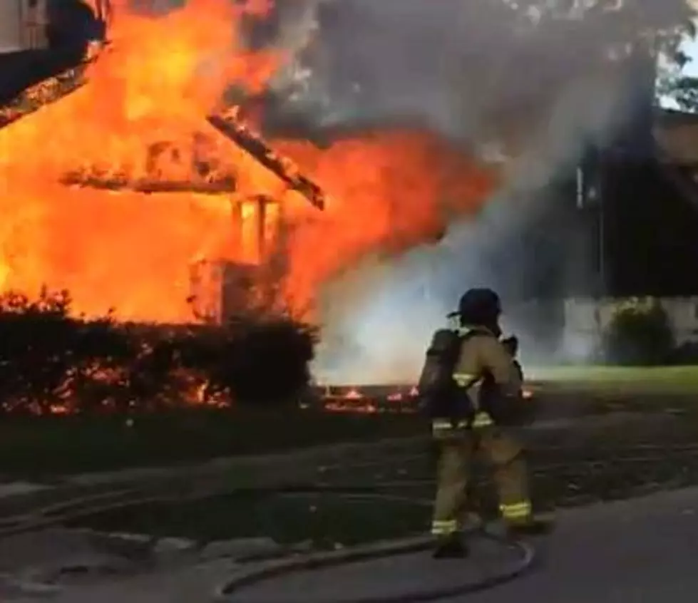 Flint Firefighter Rescues Dog From Vacant House Fire [VIDEO]