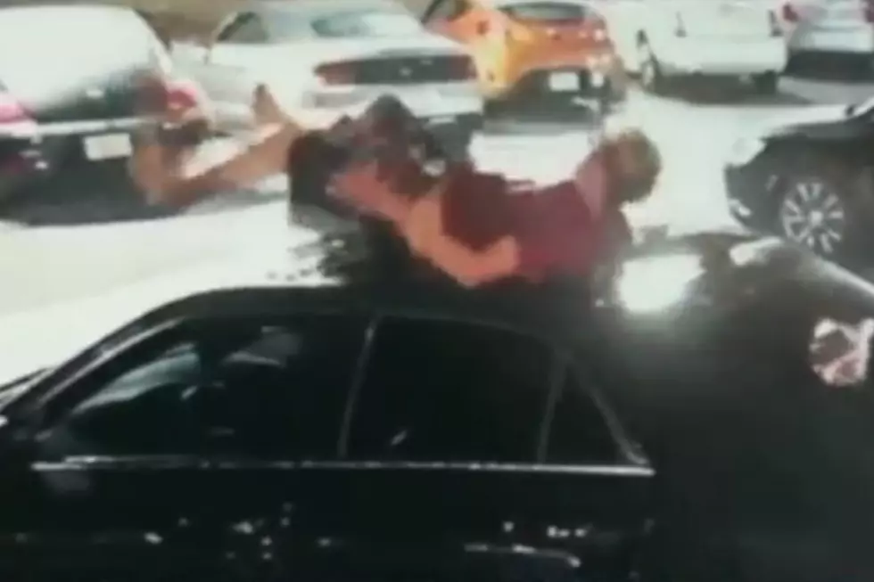 Caught on Camera:  Dude Lands on Car Out of Nowhere [VIDEO]