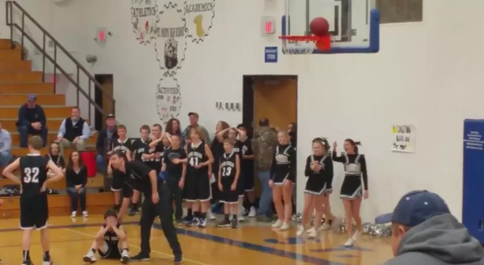 Game Winning Basketball Shot Gets Stuck On Rim As Time Expires [VIDEO]