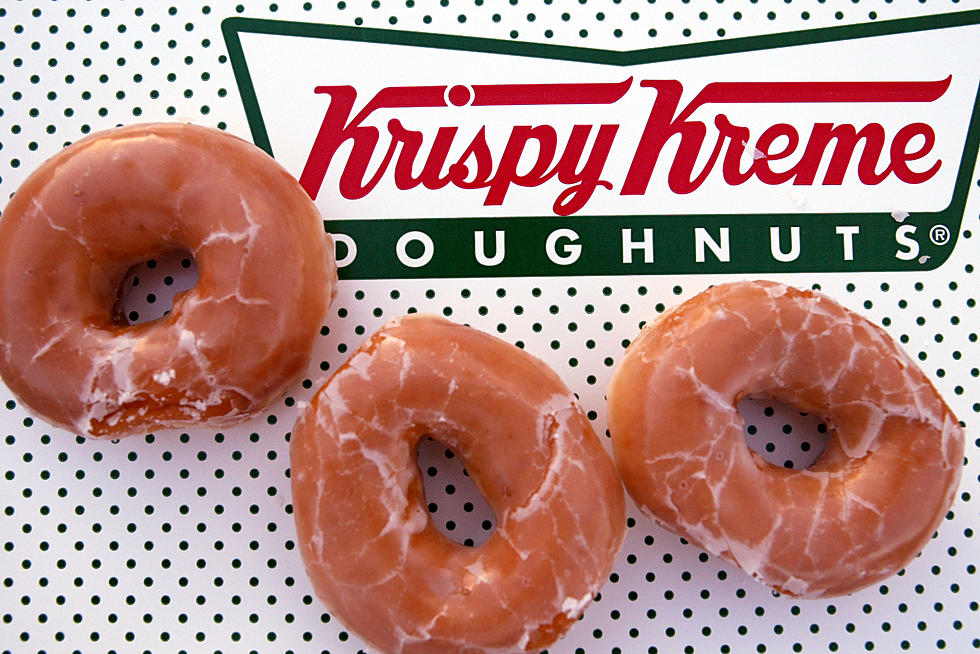 Get a Free Dozen Krispy Kreme Doughnuts Today