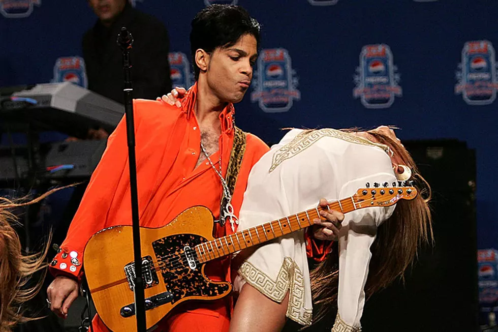 Prince Interrupts a News Conference to Perform 'Johnny B. Goode'