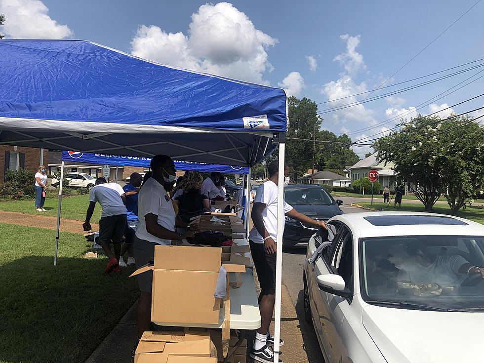 Tuscaloosa, Alabama Men Receive Free Nike Shoes at Community Event