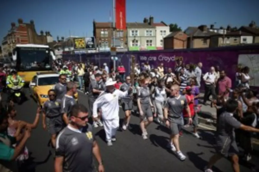 Dude Tries to Steal Olympic Torch! [VIDEO]