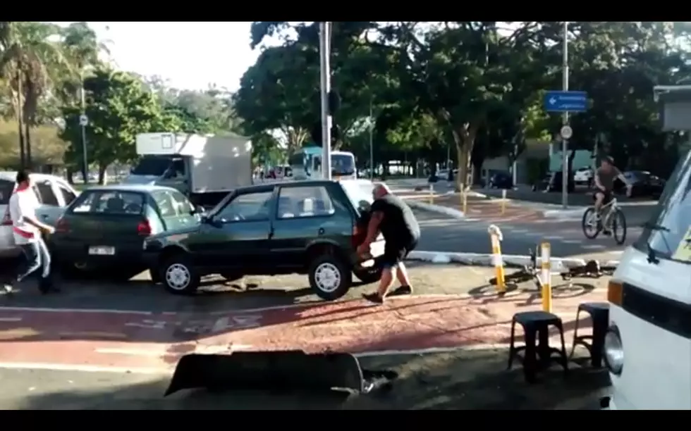 Watch This Guy Pick Up + Move a Car That Was Blocking a Bike Lane by Himself [VIDEO]