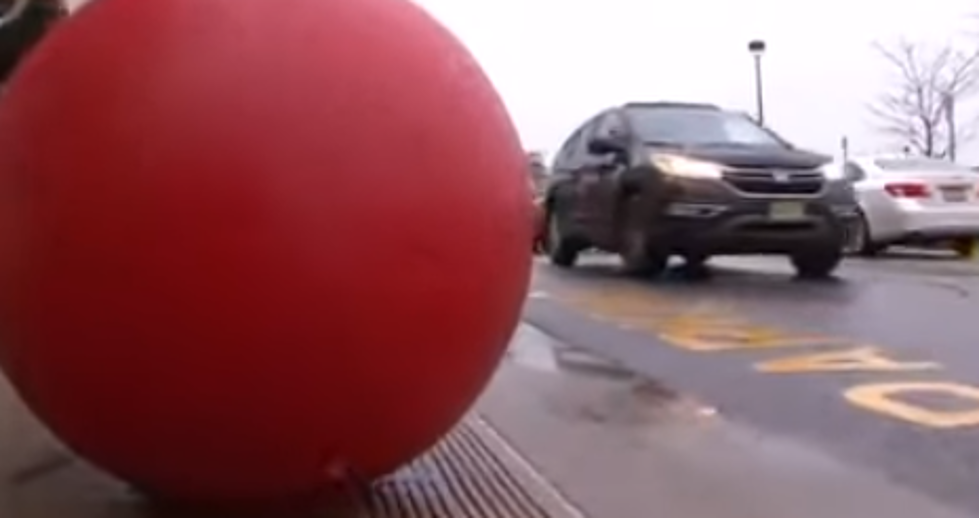 Big red ball protects West Allis Target from careening car