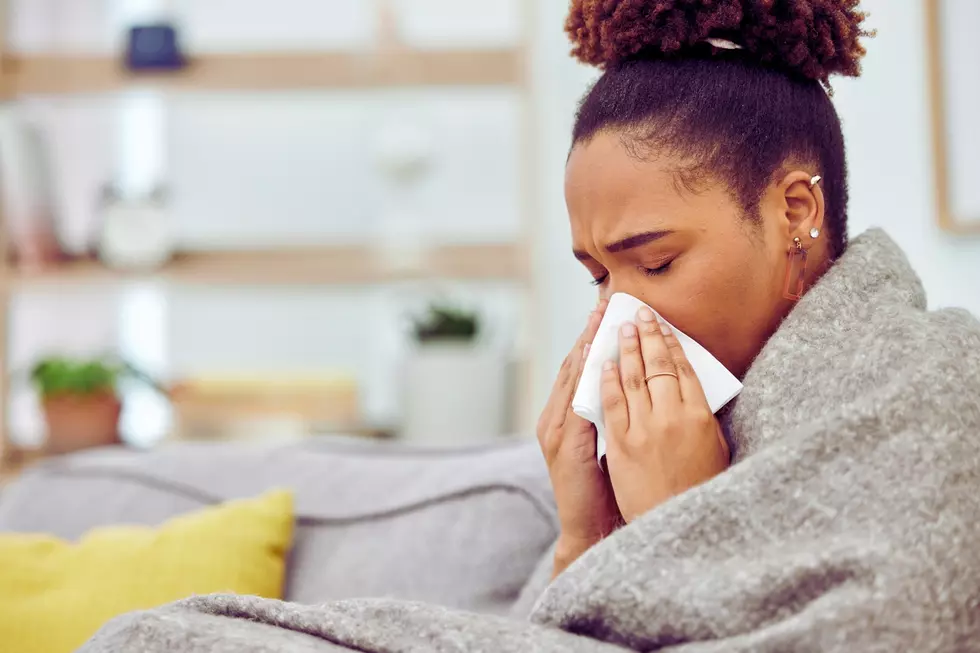 sick woman under blanker