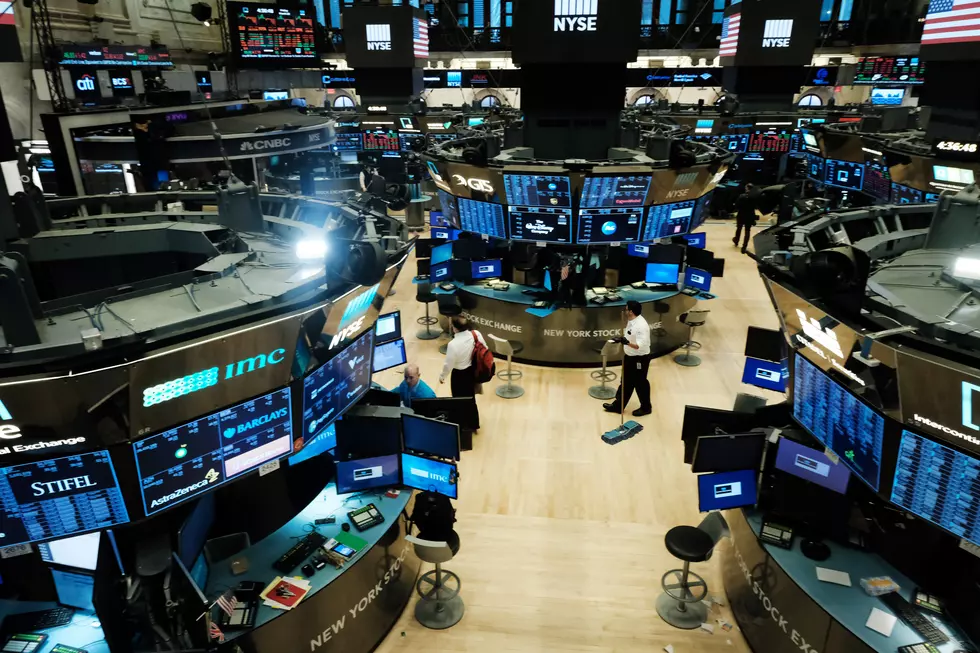 Dow Sinks 1,800 as Virus Cases Rise, Deflating Optimism
