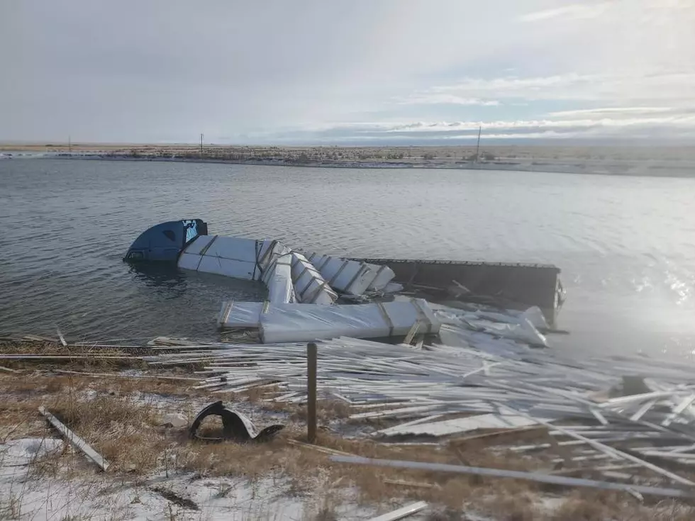 PHOTOS: Semi Truck Submerged in Pond Along I-80, Driver Swims to Safety