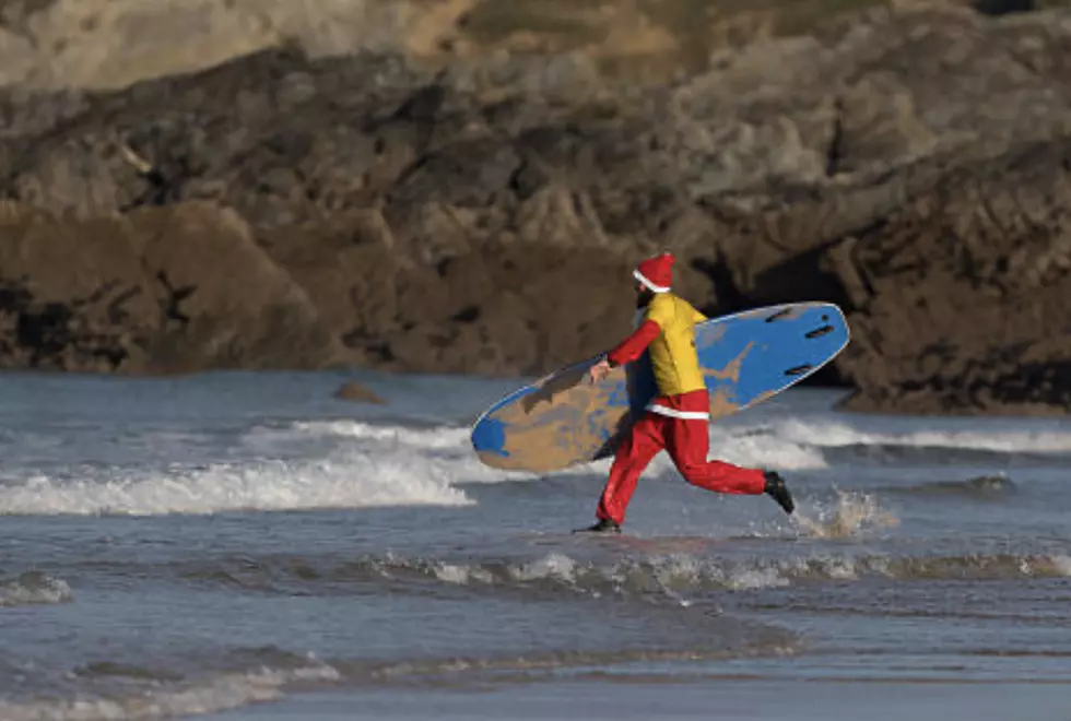 Frigid weather doesn&#8217;t stop Santas surfing off Florida coast