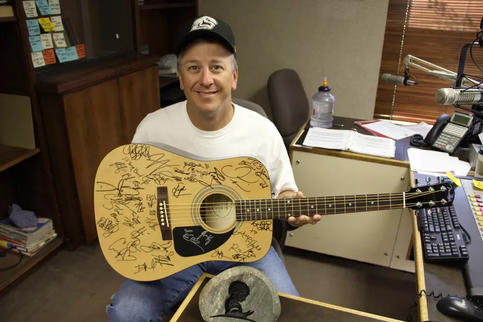 Win This Autographed Guitar By Becoming A Partner in Hope Today