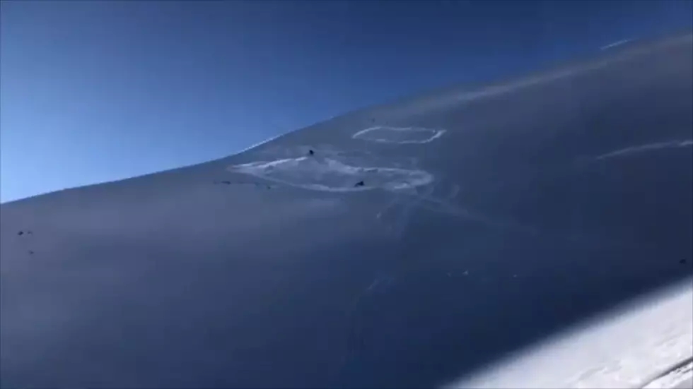 Watch 2 Snowmobiles Drive Straight into an Avalanche (and Live)