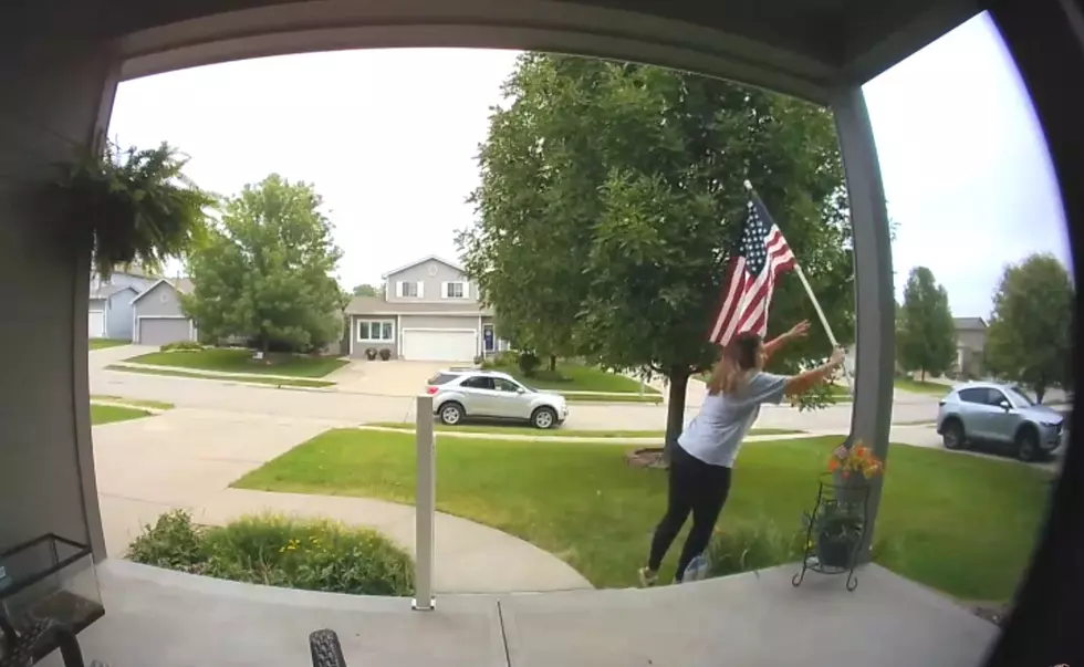 Woman Stops Car in Middle of the Road to Fix Fallen American Flag