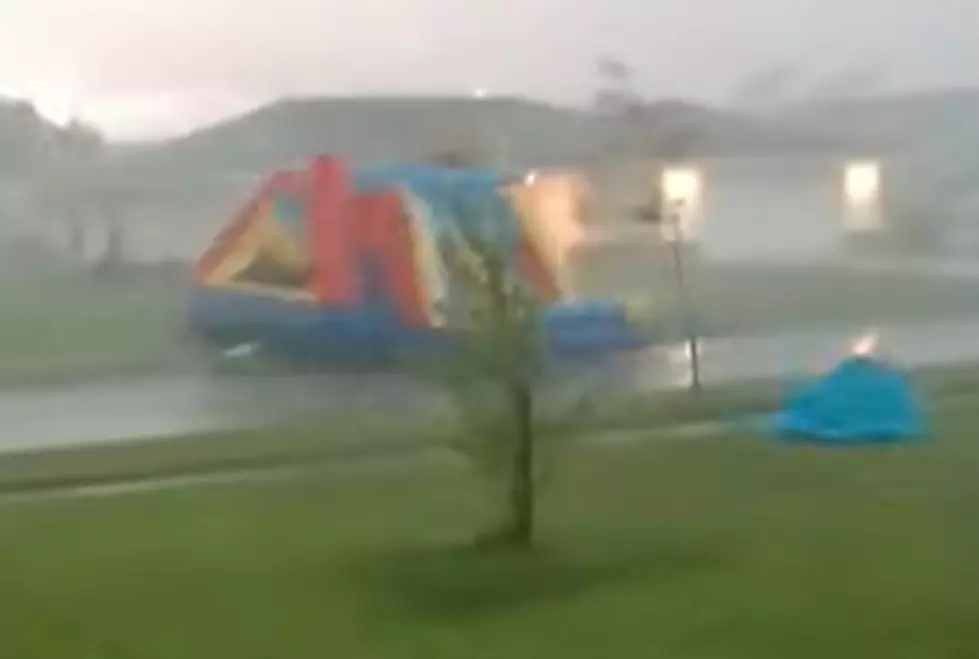 Watch: Bounce House Goes Flying Through A Neighborhood