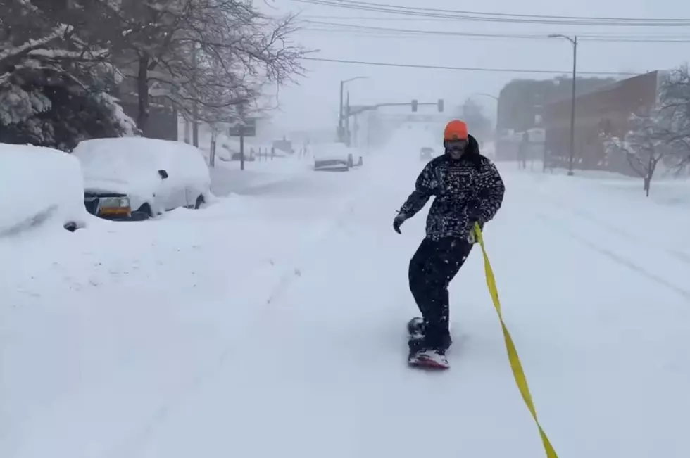 Watch this Rad Dude Snowboard Thru Downtown Cheyenne in Blizzard