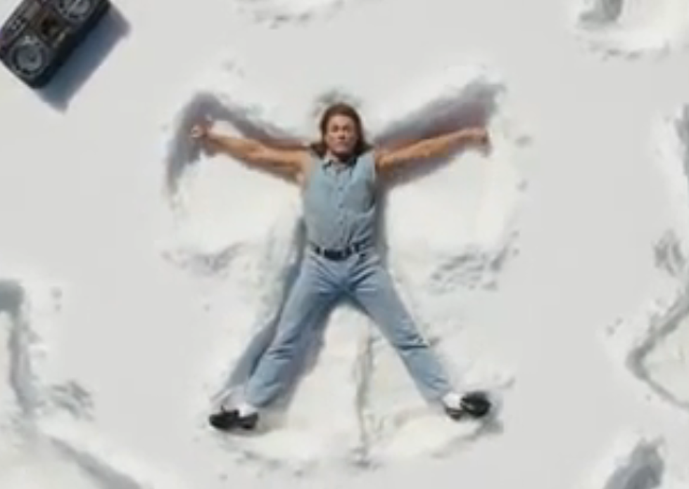 Jean-Claude Van Damme Making Snow Angels and Singing Love Songs for Beer [VIDEO]