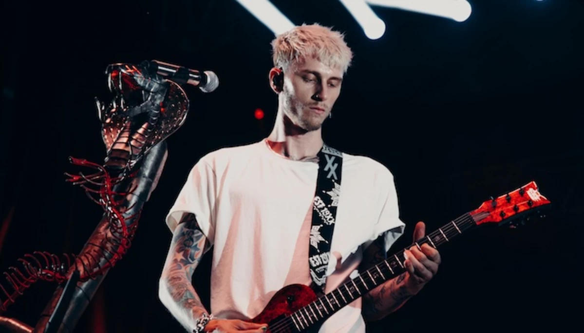 Machine Gun Kelly leans into rock side with “why are you here”