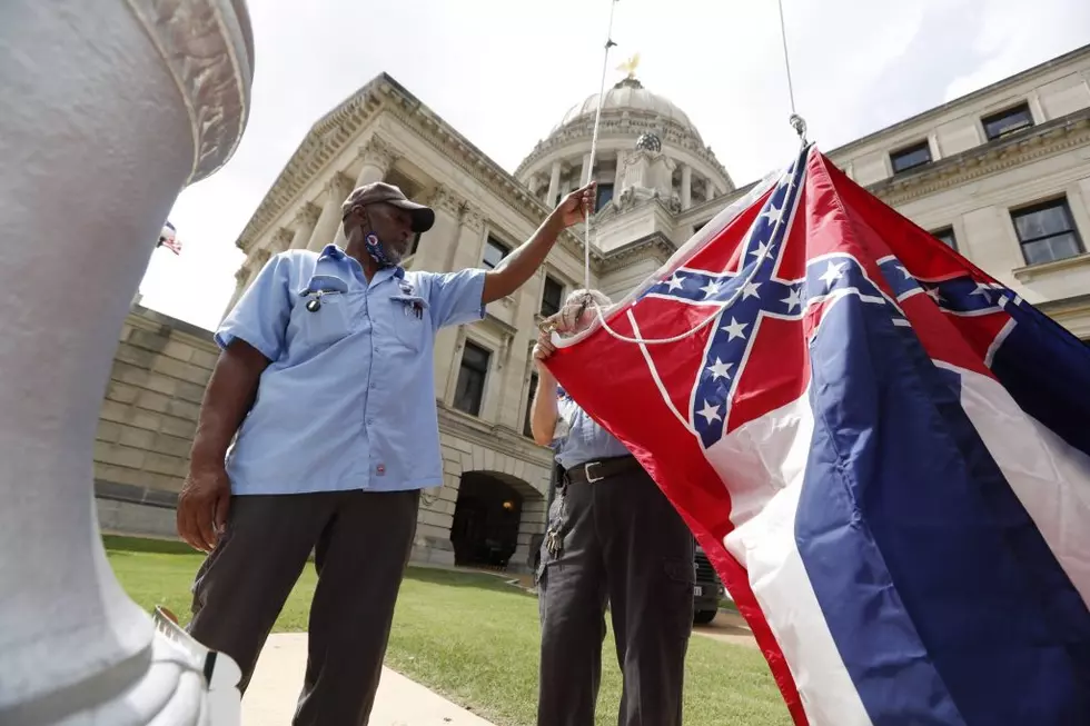 Mississippi governor signs bill removing Confederate symbol from state flag