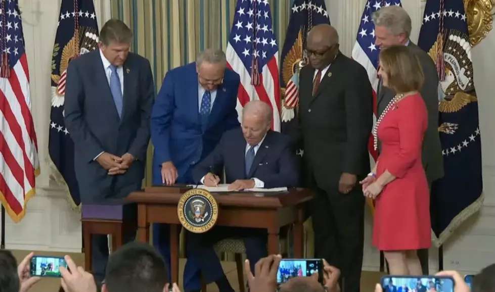 Sweeping climate, health care and tax bill signed into law