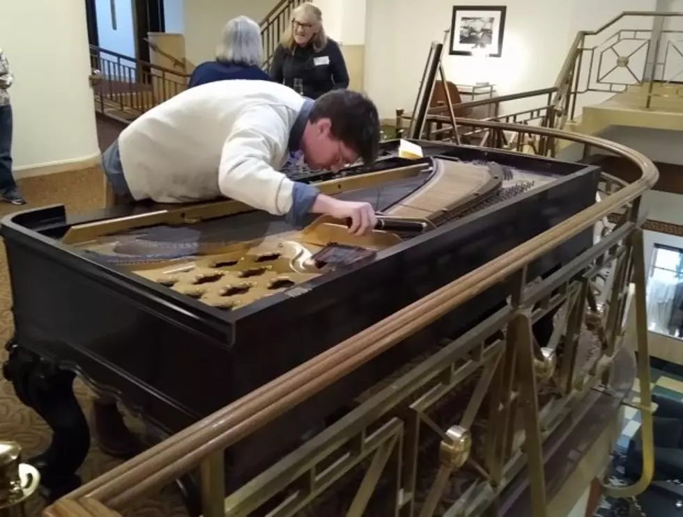 Historic piano is tuned before being played for first time in decades. (Jim Harmon/Missoula Current)