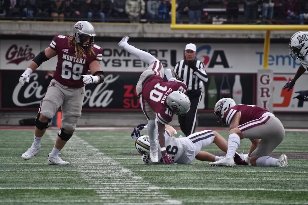 Eli Gillman falls over Bobcat defender. (William Munoz/Missoula Current)