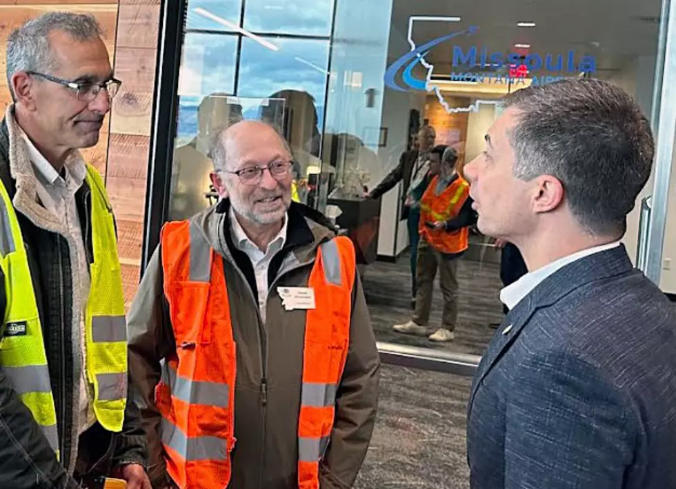 U.S. Secretary of Transportation Pete Buttigieg speaks with Missoula County Commissioners Dave Strohmaier, center, and Josh Slotnick. (Courtesy photo)