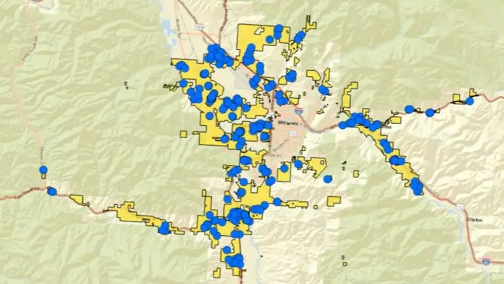The Missoula Rural Fire District's boundaries are marked in yellow, while the blue dots represent new development.