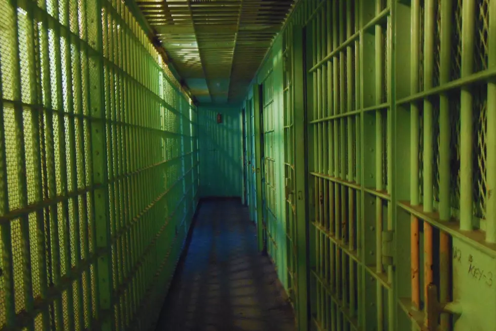 a corridor of empty jail cells