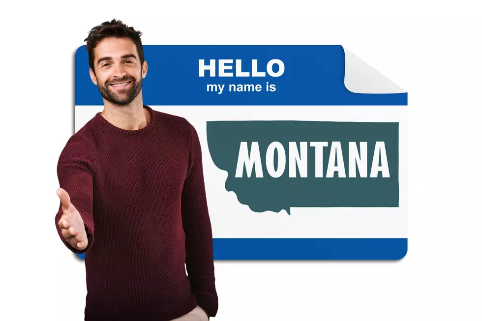 A man reaching out his hand to shake it with the back ground being a "hello my name is" name tag