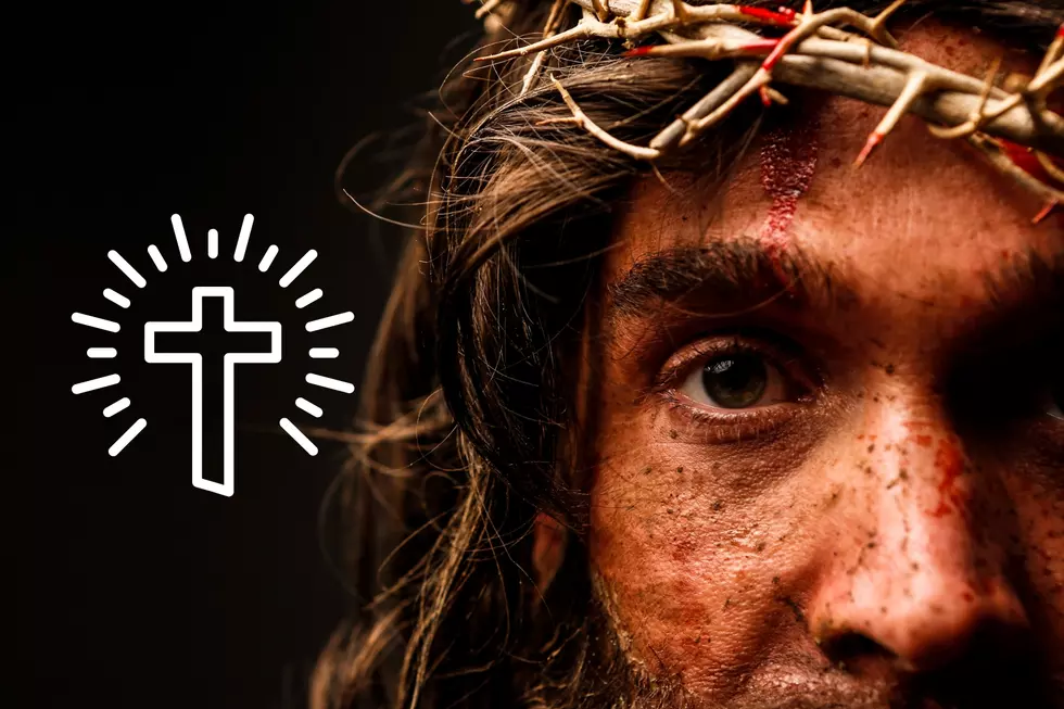 A close up shot of a man portraying Jesus Christ with a crown of thorns and bloody face
