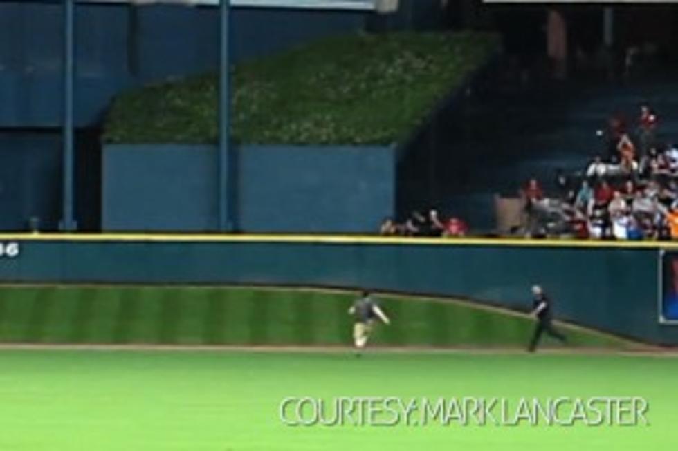 The Great Escape: Baseball Fan Leaps Onto Field, Eludes Police
