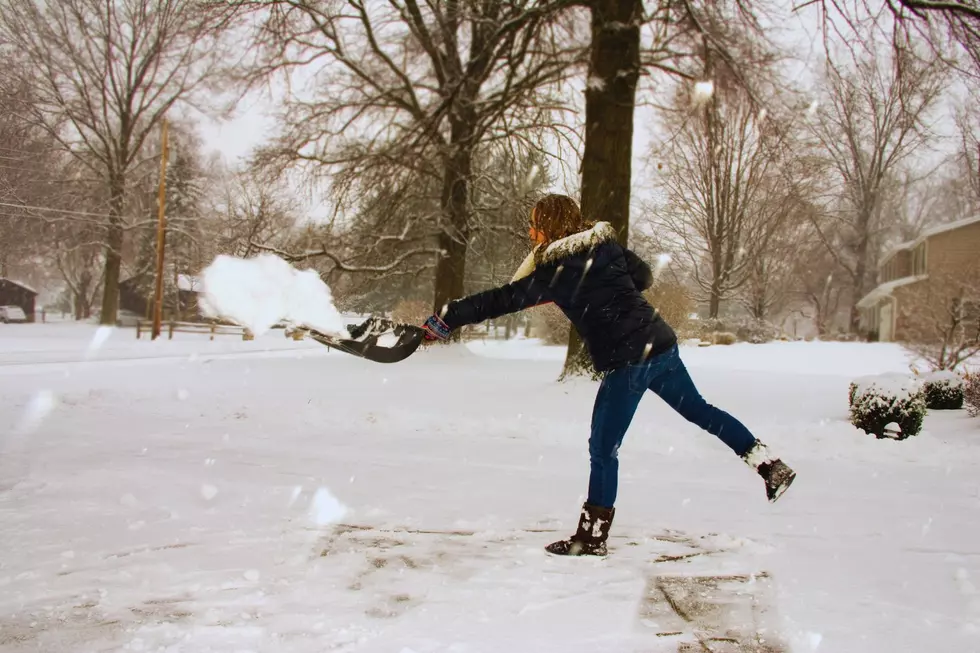 woman shoveling snow