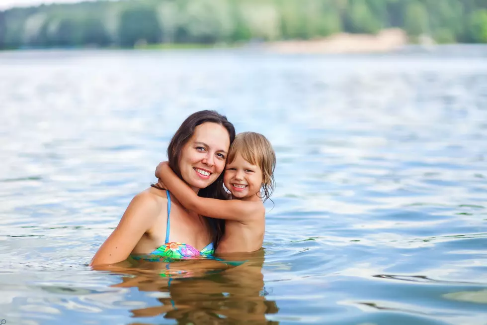 mom and child swimming in montana