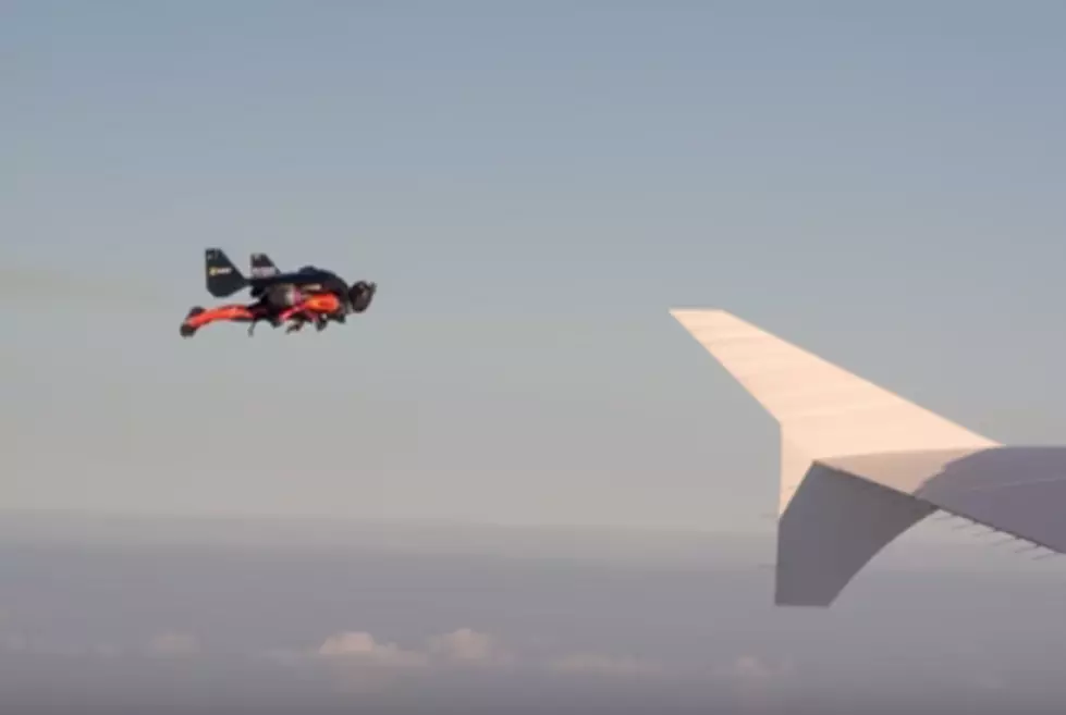 Two Jet Pack Men Fly Next to Airliner! [VIDEO]