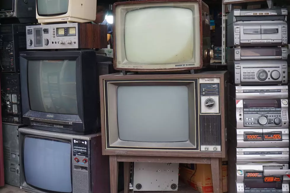 Old TVs stacked on top of each other