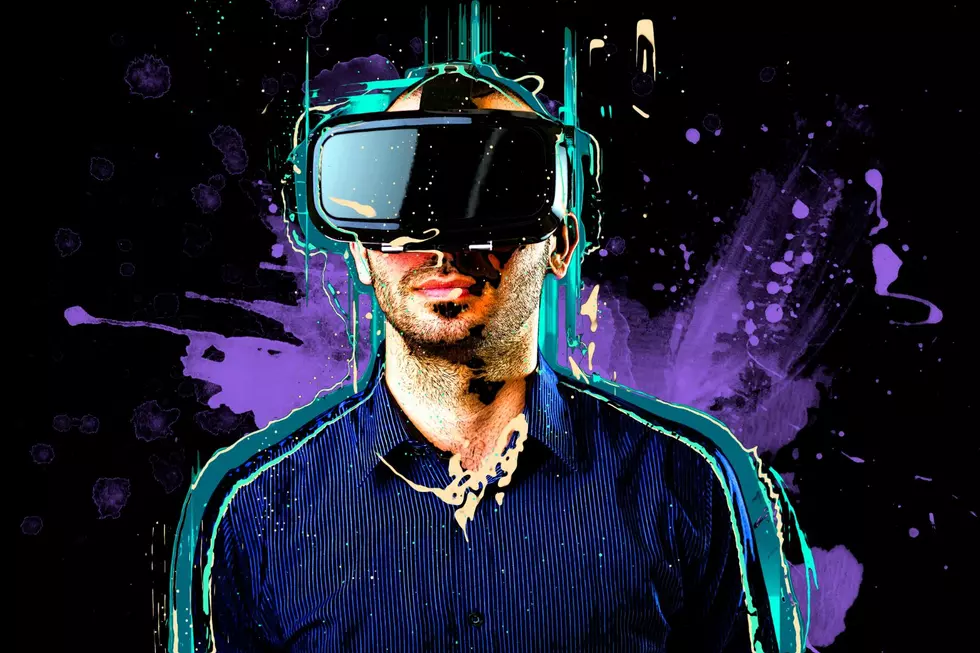 Man wearing a VR helmet in a vr space