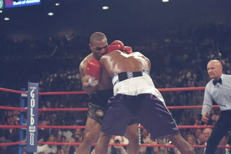Mike Tyson bites an ear off