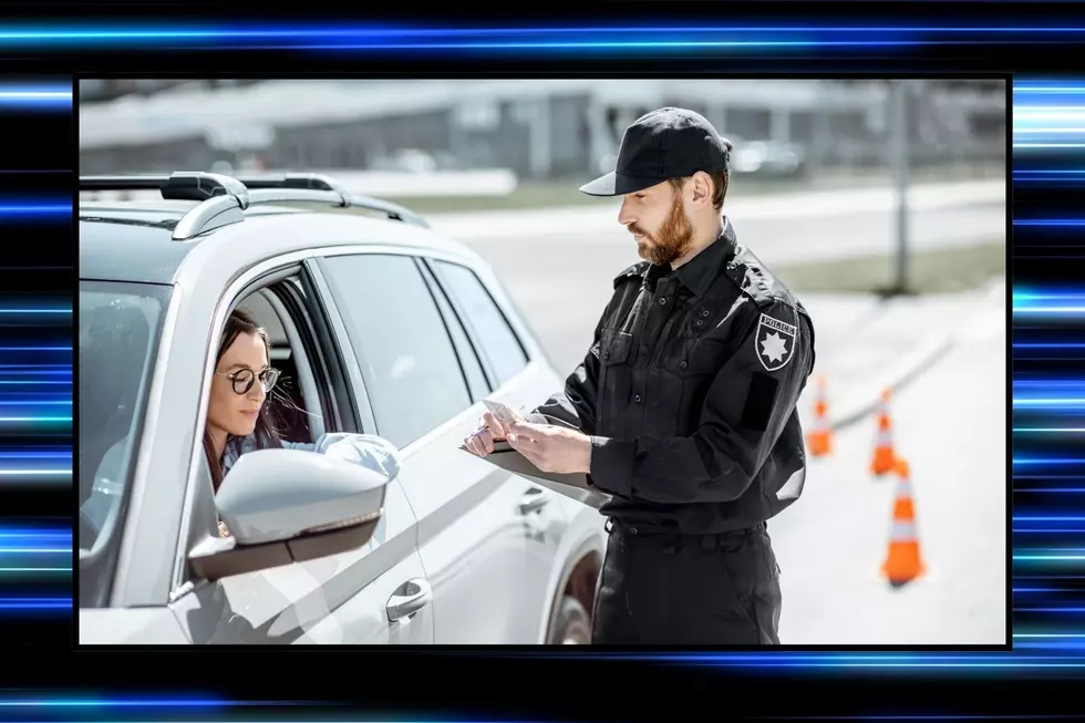 A police officer pulls a woman over