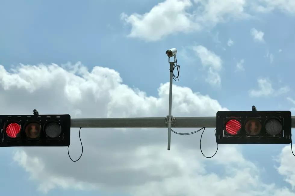 Blue Lights would be mounted above existing traffic lights. -Canva