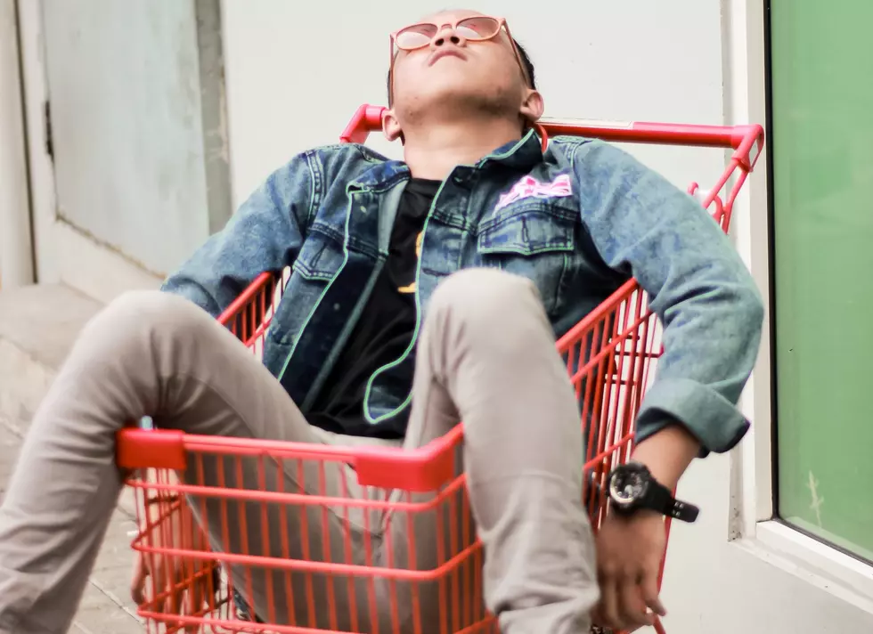 Photo by eminumana: https://www.pexels.com/photo/person-on-red-grocery-cart-2871490/
