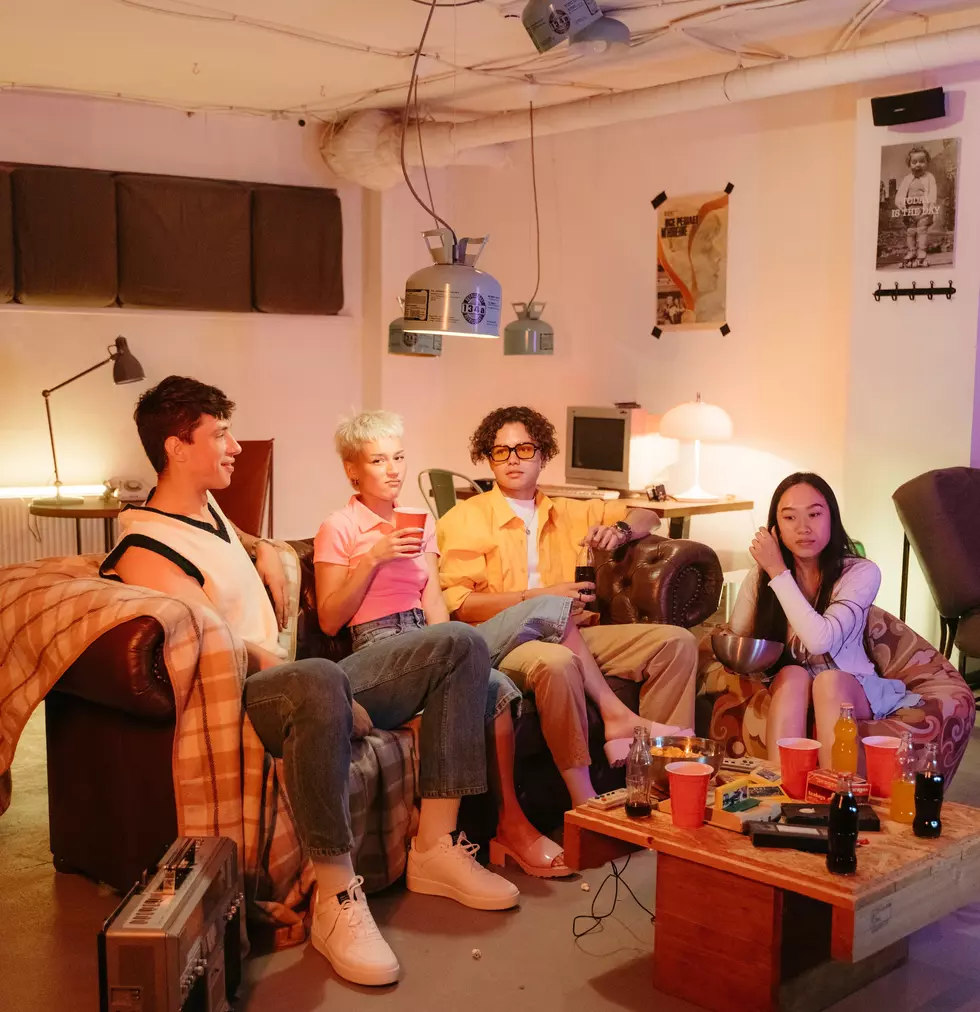 Photo by MART PRODUCTION: https://www.pexels.com/photo/a-group-of-friends-sitting-together-in-a-living-room-8885108/