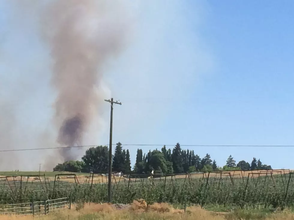 Selah fire sends up a column of smoke
