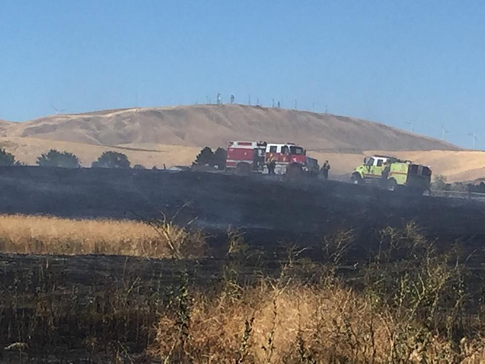 Fire burns 15 acres in South Kennewick after lawn mower blade hits rock