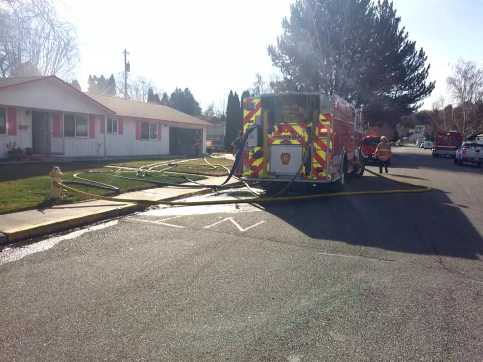 Kennewick woman wakes up to fire in garage