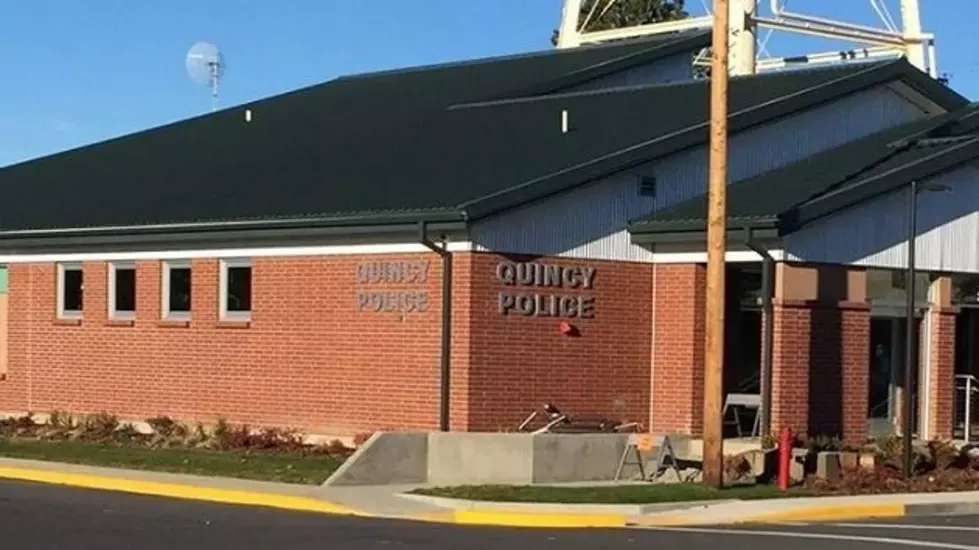 Quincy Police Holding Donuts with a Cop