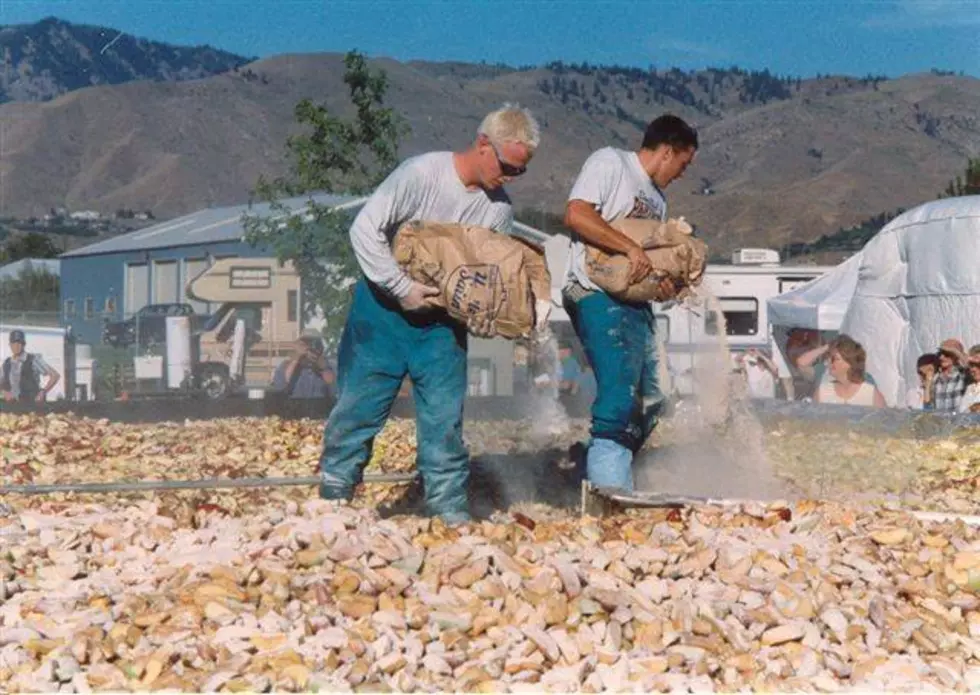 Pouring sugar & cinnamon into the World's Largest Apple Pie CREDIT Wenatchee Valley Museum & Cultural Center (via Facebook)