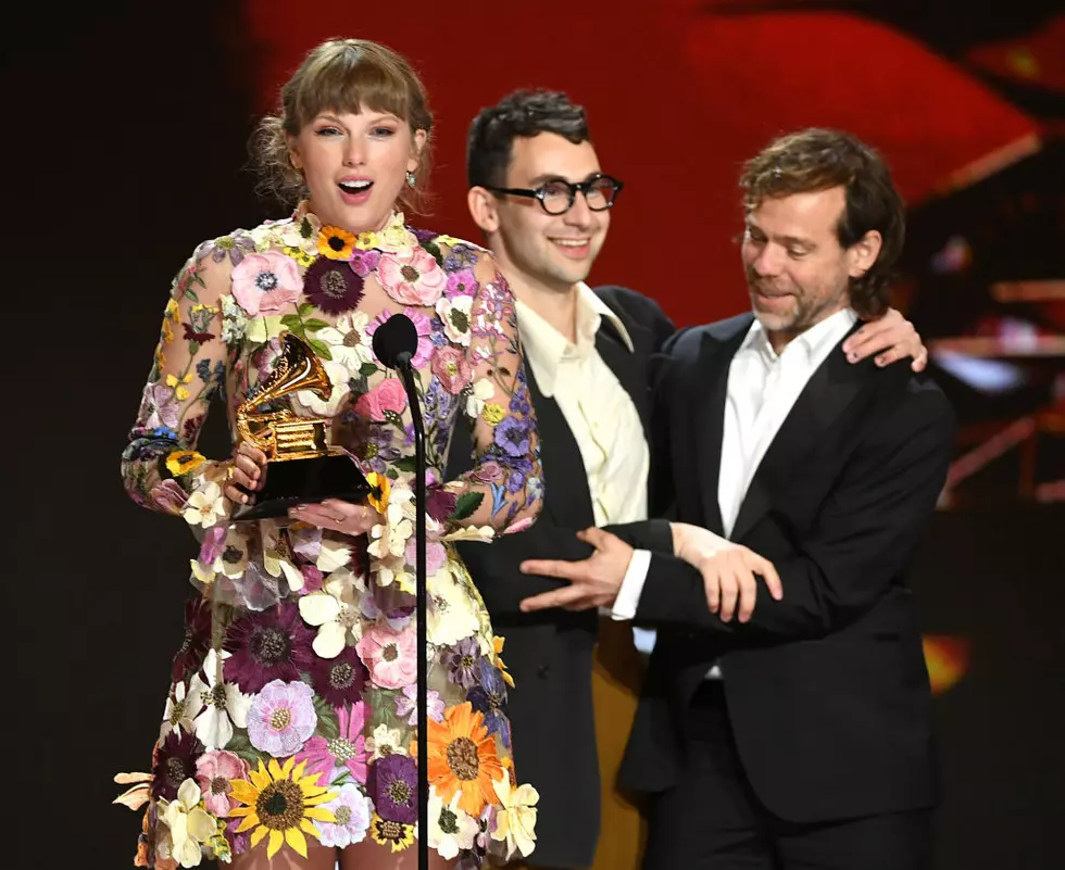 Taylor Swift, Jack Antonoff, and Aaron Dessner accept the Album of the Year award for &lsquo;Folklore&CloseCurlyQuote; during the 63rd Annual GRAMMY Awards (Photo by Kevin Winter/Getty Images)