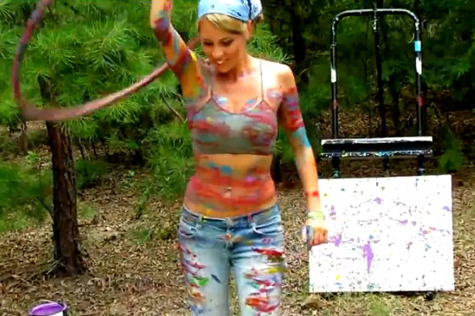 Woman Makes Art Using a Hula Hoop Filled With Paint